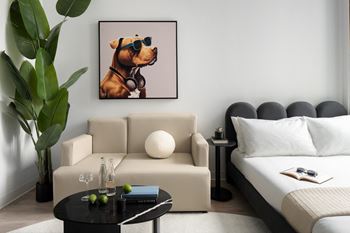the dog with goggles art print displayed in a living room